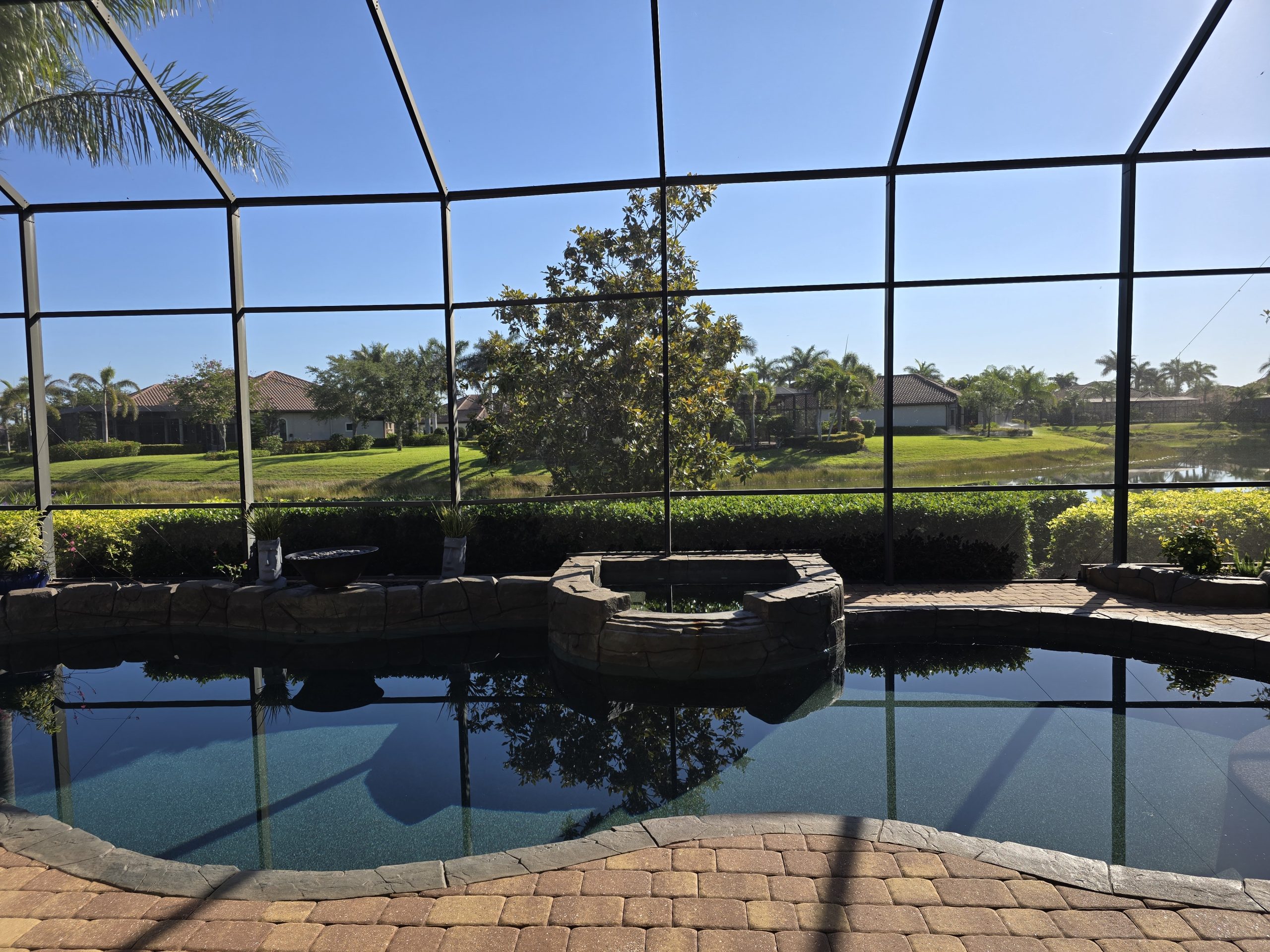 Aluminum Master technician providing free estimate for screen enclosure in Naples Florida