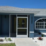 Custom front entryway screen enclosure installed by Aluminum Master in Naples Florida