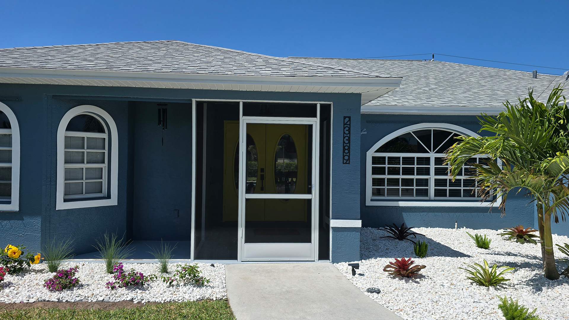 Custom front entryway screen enclosure installed by Aluminum Master in Naples Florida