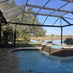 Newly constructed pool cage enclosure in Naples, FL built by Aluminum Master LLC with durable aluminum framing and UV-resistant screen mesh.